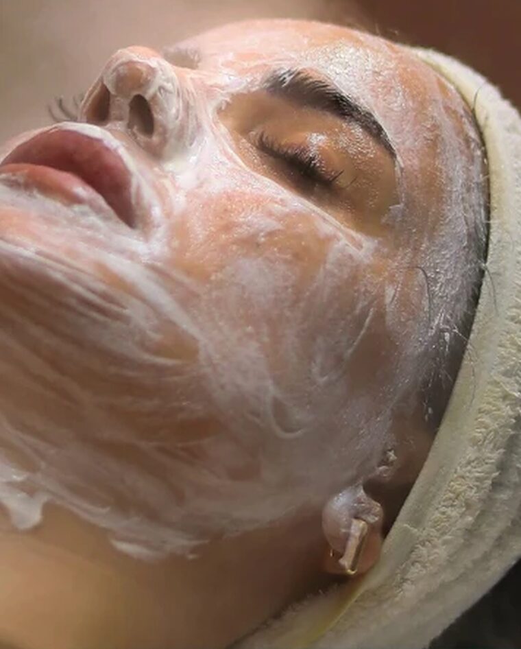 A client relaxing during a customized facial